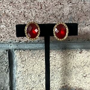 Vintage JJG signed red faceted oval clip earrings with rhinestone halo